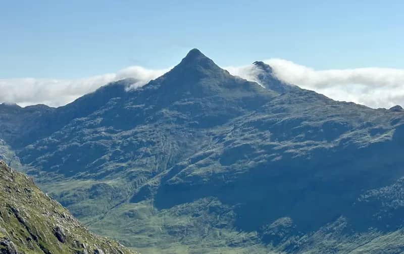 DREAMY SPIRE: The mini Matterhorn of Sgurr na Ciche wearing a wreath of clouds seen from the Mam Meadail