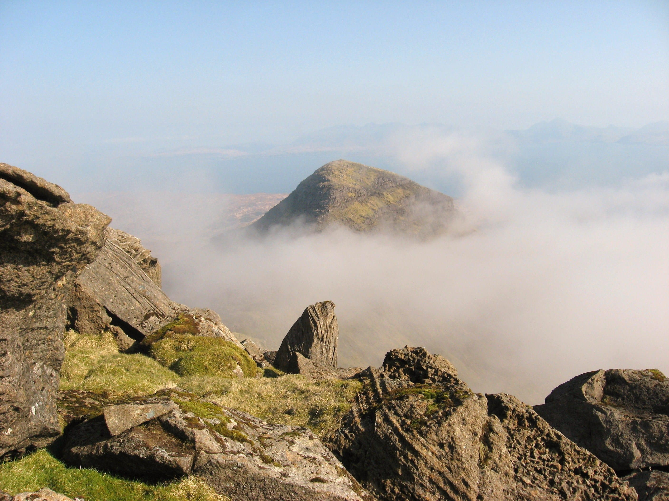 'PEEK SHOW: Hallival''s peak peeks out from a sea of wispy cloud in this view from the slopes of Askival'
