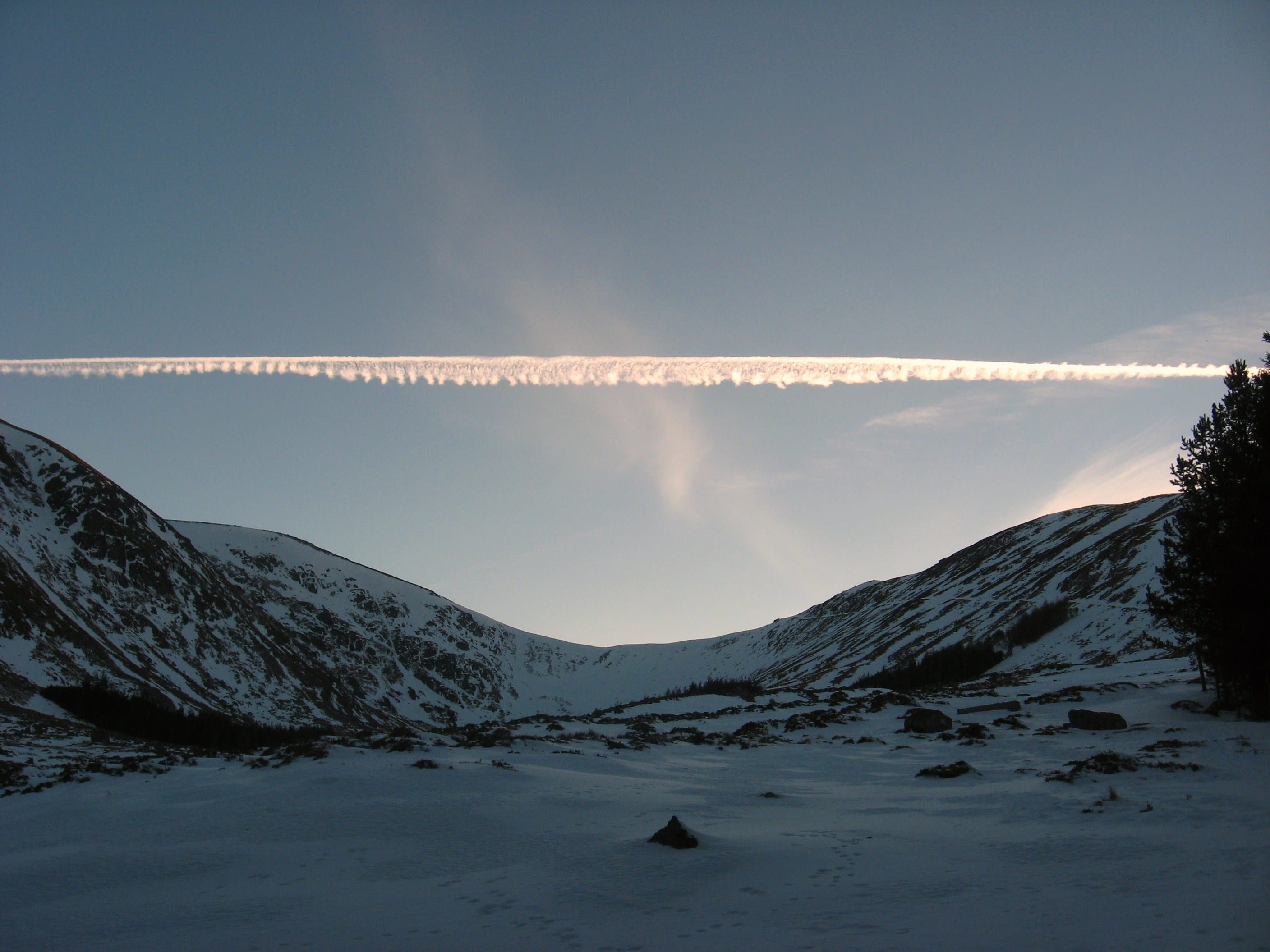 JOLLY GOOD FOLLOW: Jet trails on a clear sky on a frozen winter's day below the Shank of Drumfollow