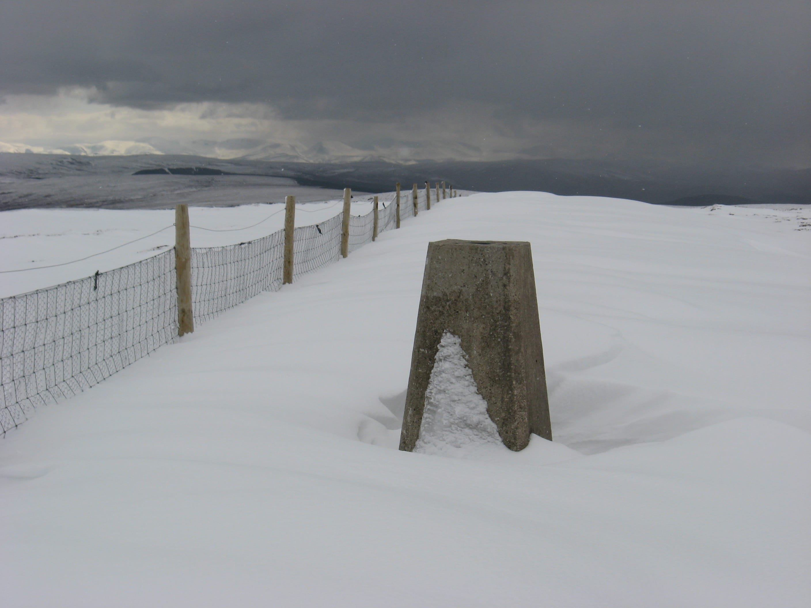 SNOW-GO AREA: The summit trig point of the flat-topped Carn nan Tri-tighearnan is half-buried in a sea of white