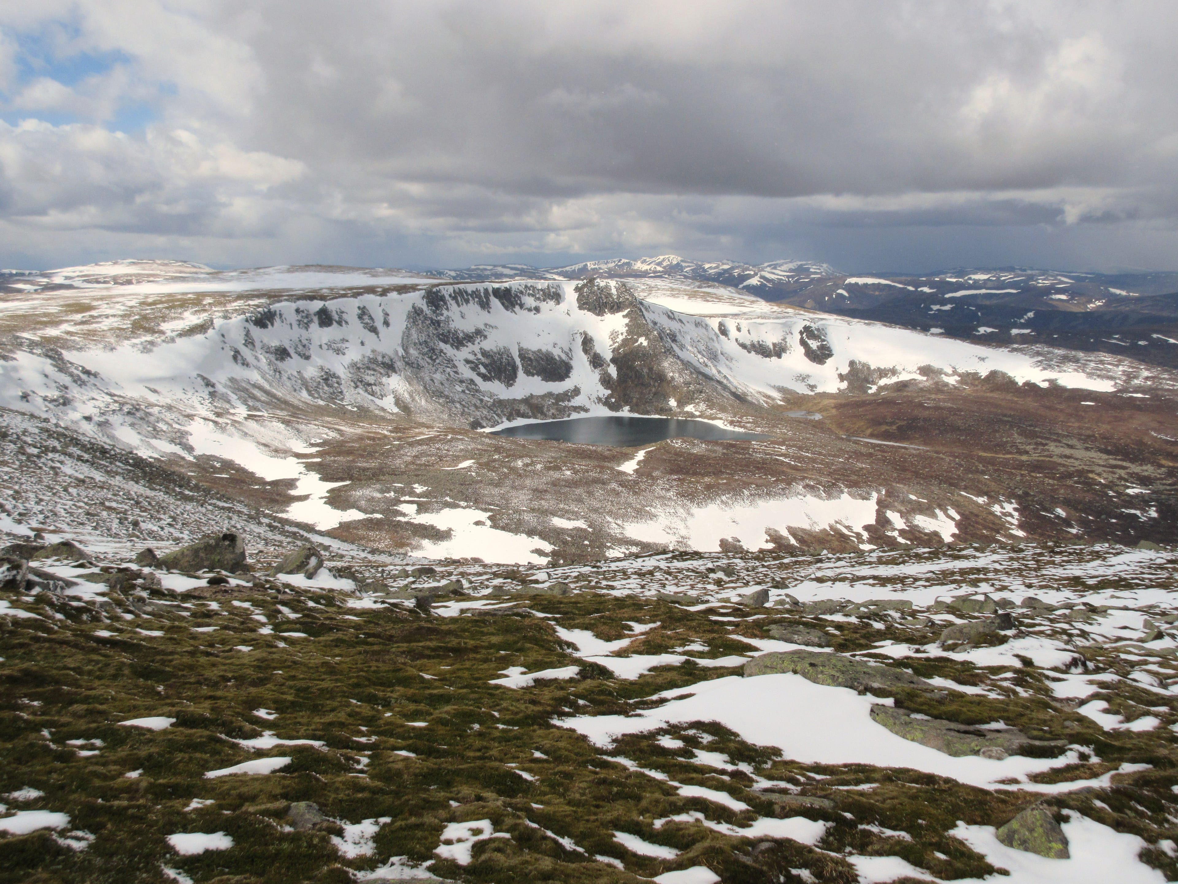 'DEESIDE JEWEL: The snow-plastered prow of The Stuic and the waters of Loch nan Eun from the summit slopes of Lochnagar '