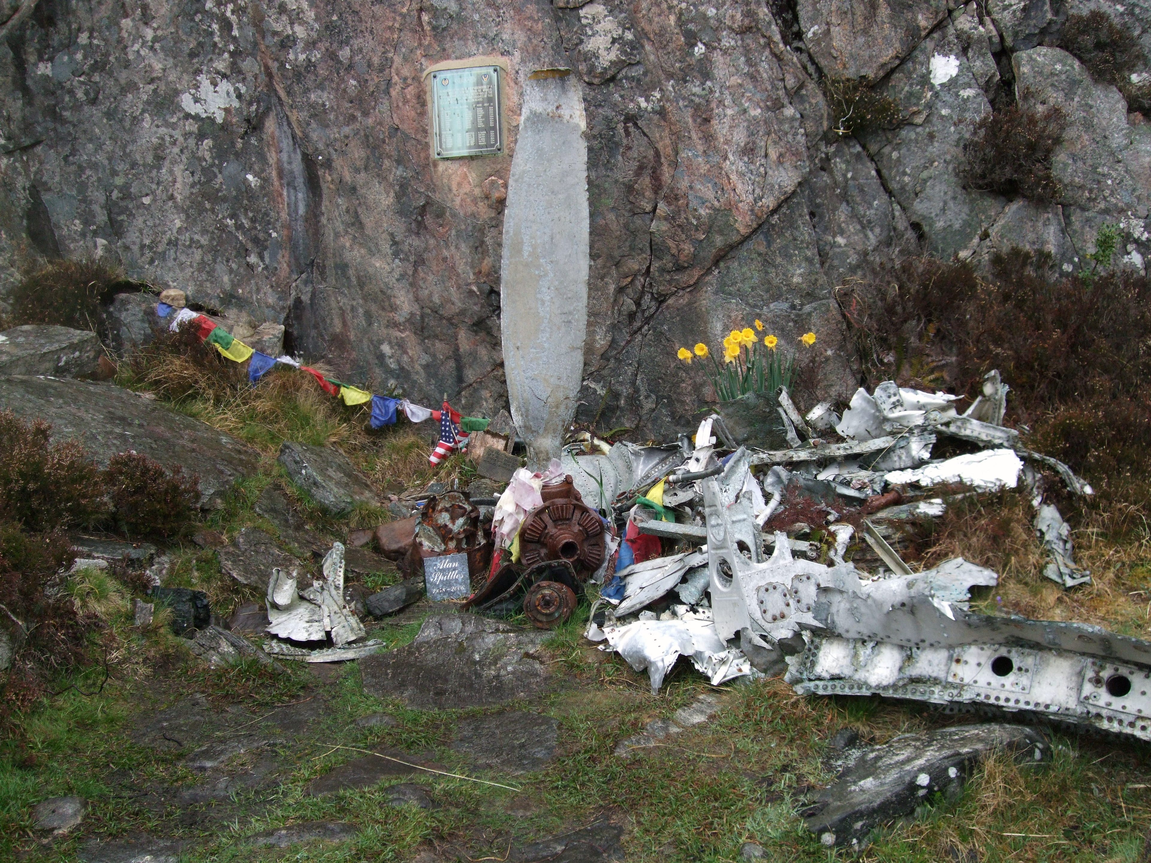 TRIBUTES: Souvenirs and tributes mark the site where a plaque remembers 15 lost souls who were heading home to USA after the war