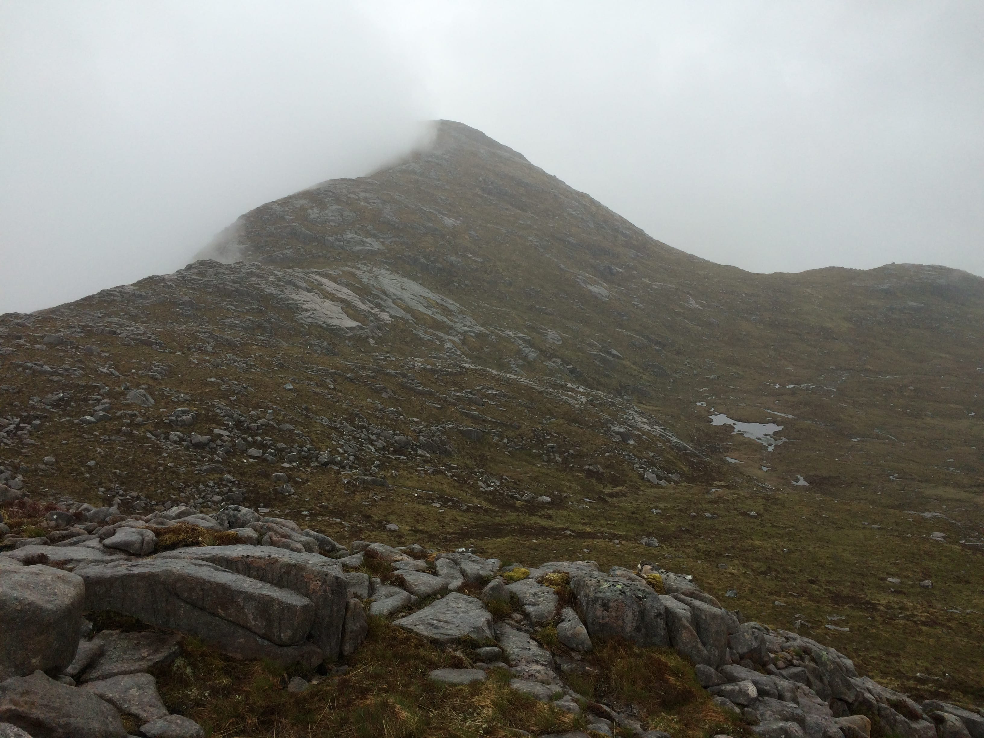 THE DARK SIDE: Looking back along Beinn nan Aighenan's less trodden south-east ridge on a misty day
