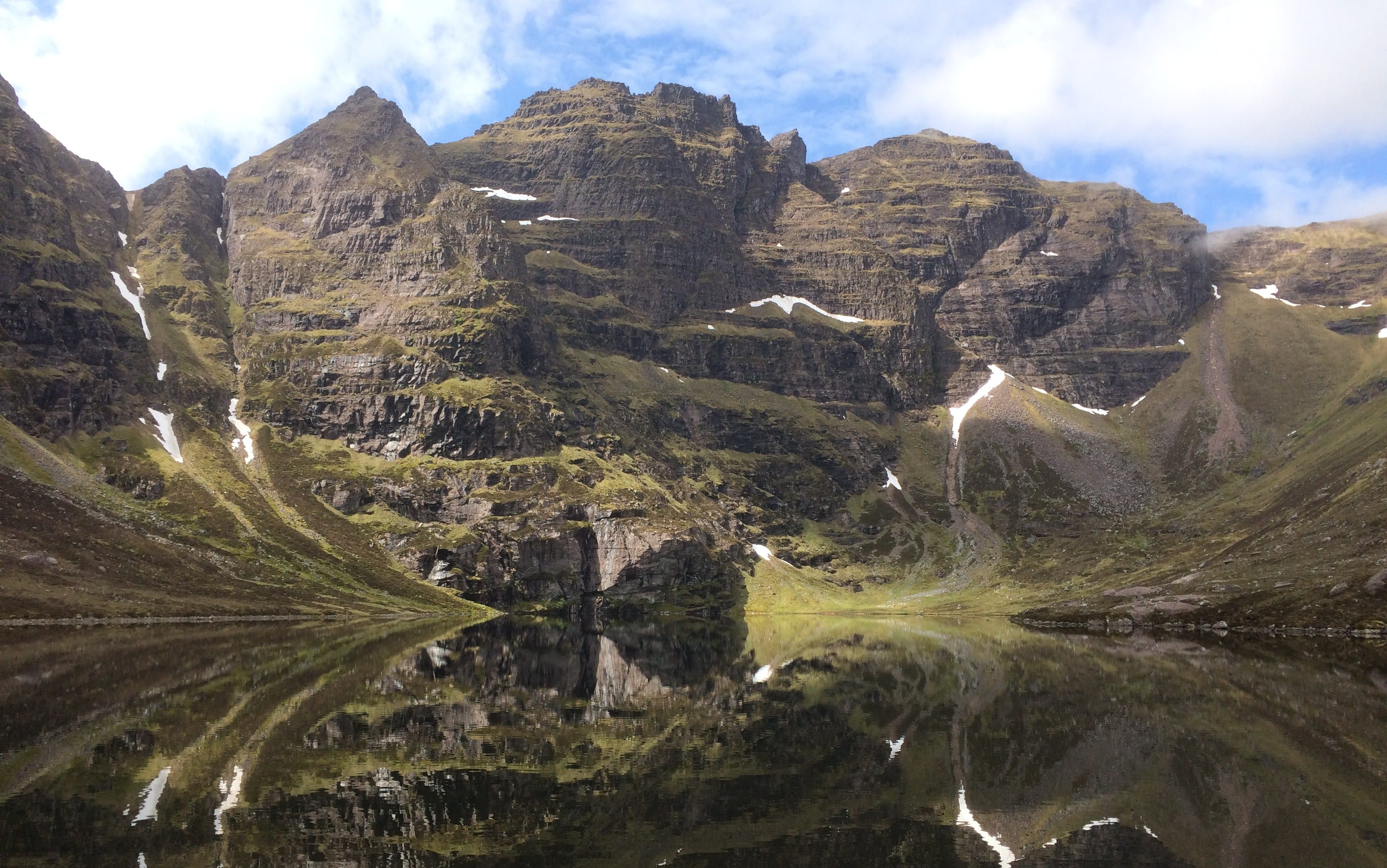 MIRROR IMAGE: Mighty An Teallach is doubly beautiful with its towers reflected perfectly in the lochan