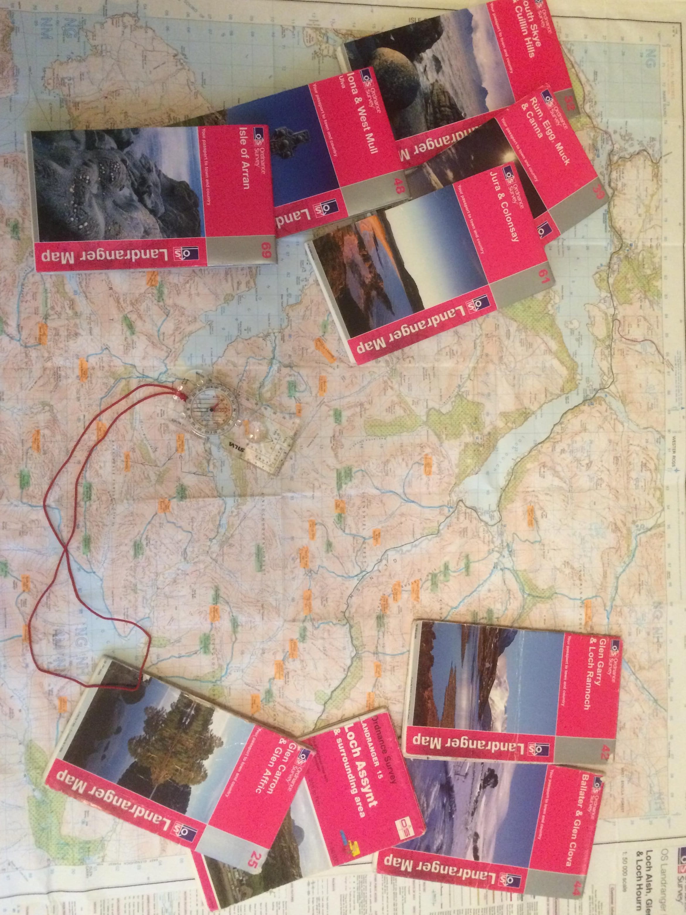 STUDYING THE OLD WAYS: When it comes to planning trips into the mountains, there's nothing to beat poring over a collection of maps