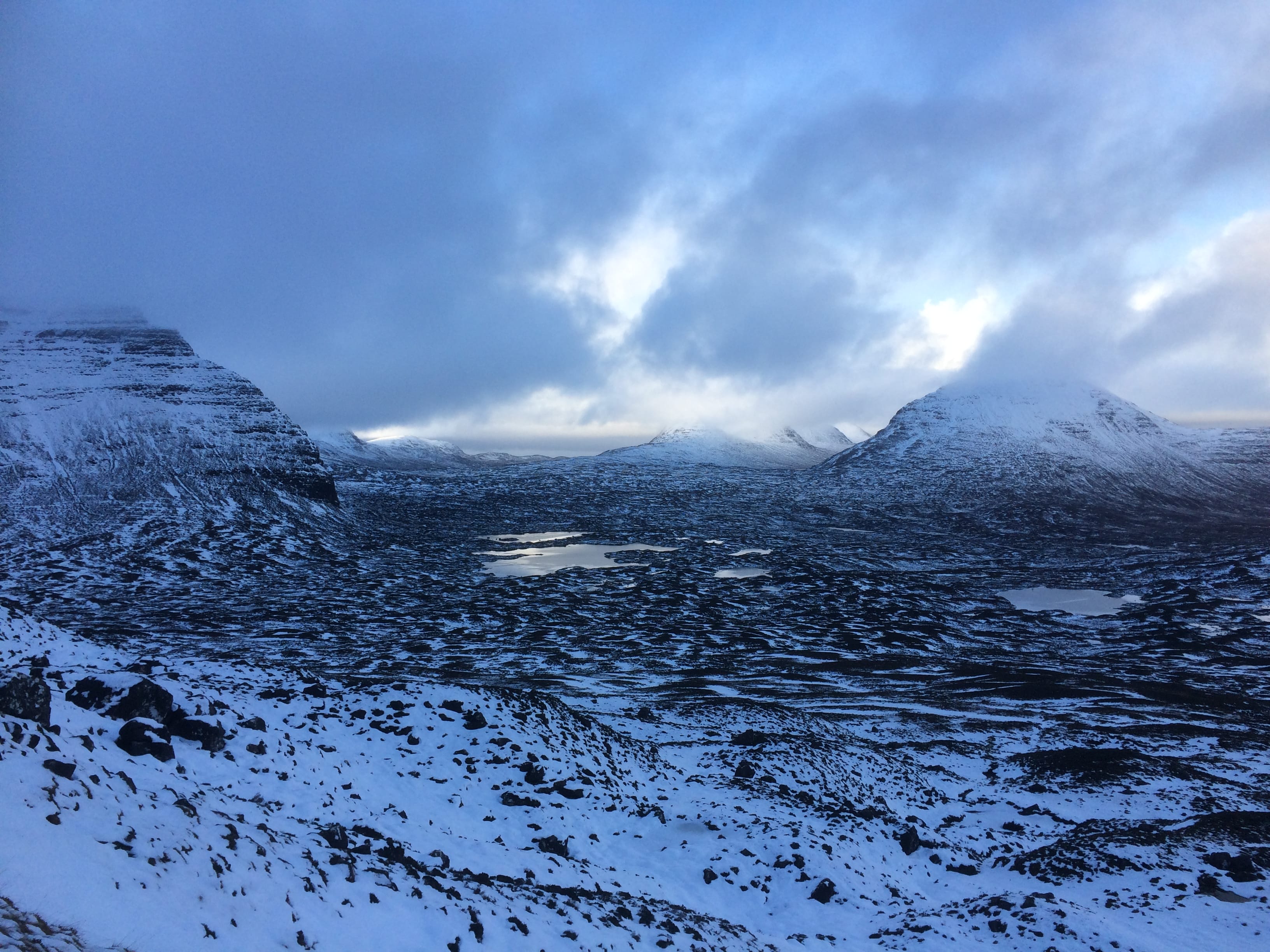 WINTER LIGHT: Sparkling lochans and snow-plastered peaks of Flowerdale on the long walk round into the heart of Beinn Eighe