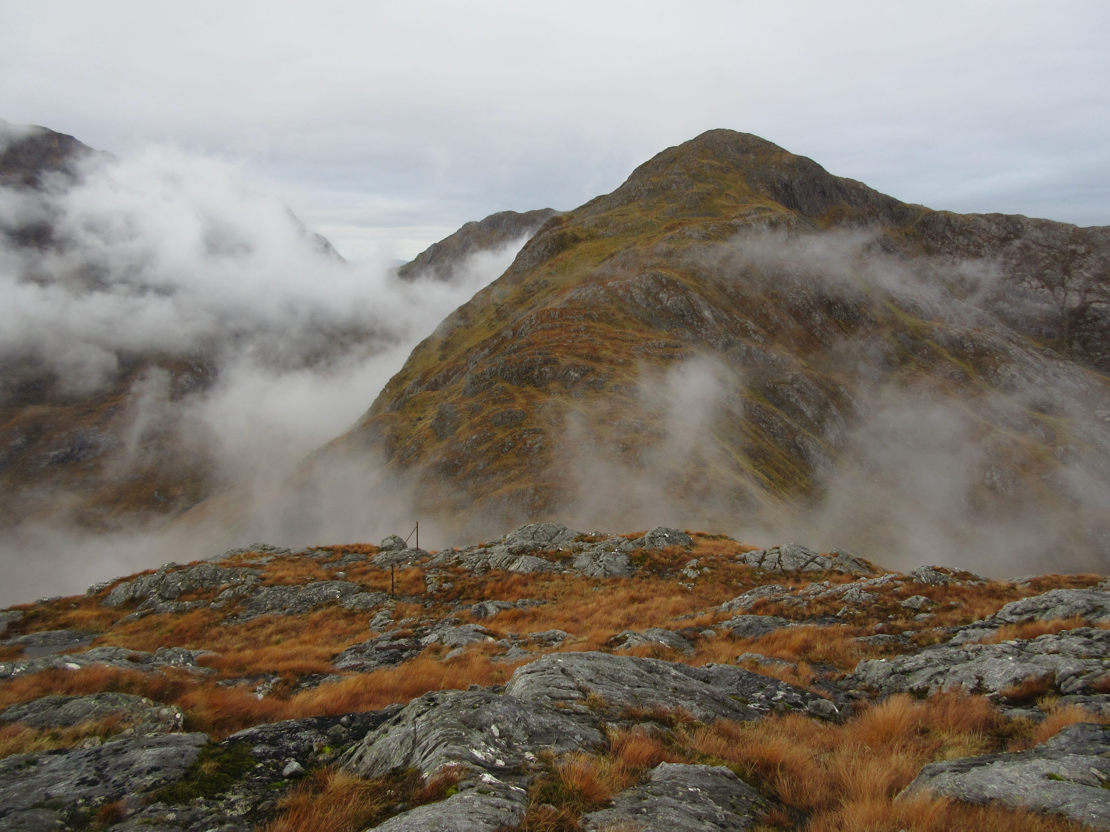 MOUNTAINS IN THE MIST: Looking ahead to Beinn Bheag emerging from the cloud during circuit of Glen Tarbert hills