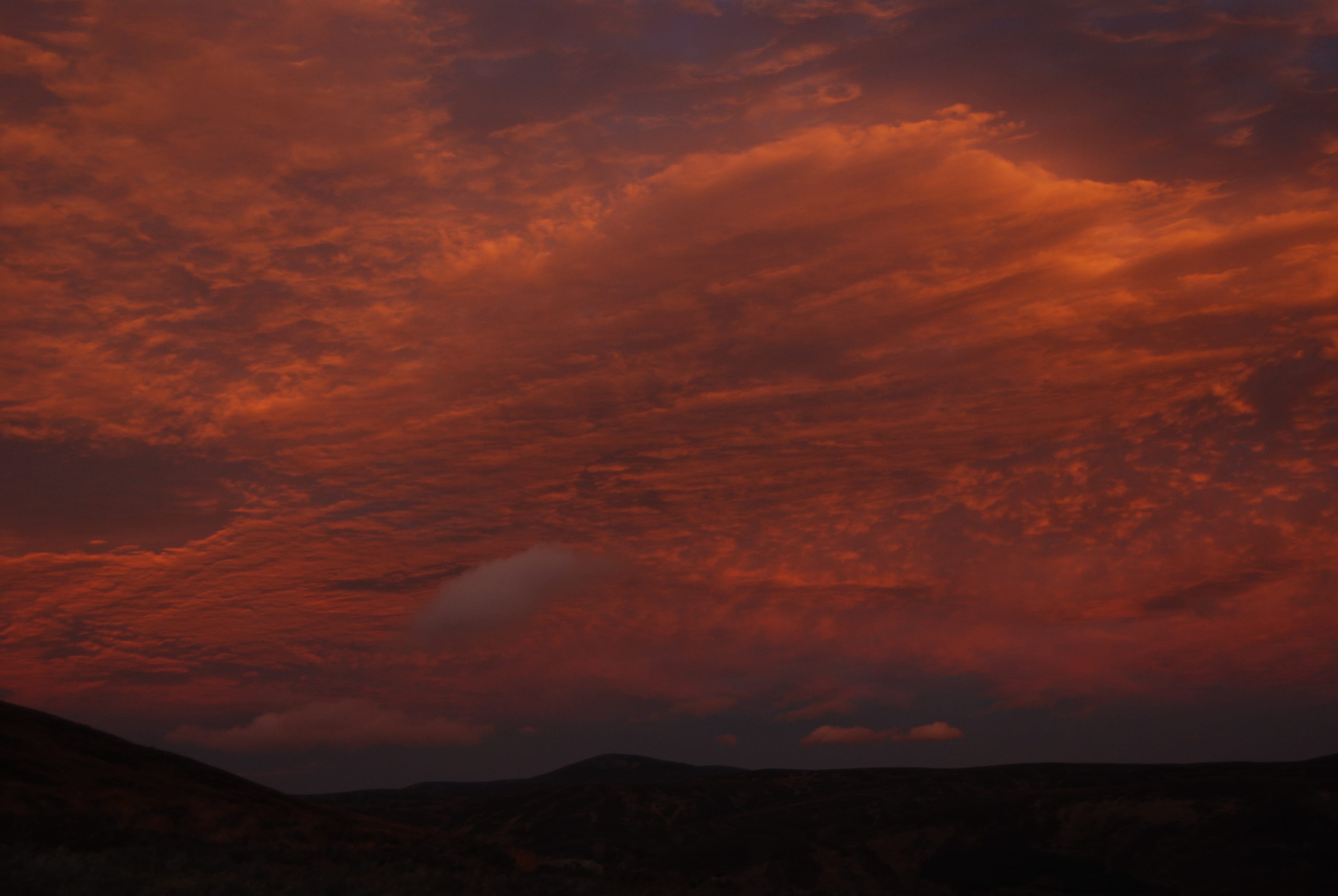 ALIEN SKIES: The cloud takes on a deep orange glow just after sunset during a traverse of Lochnagar for the full moon