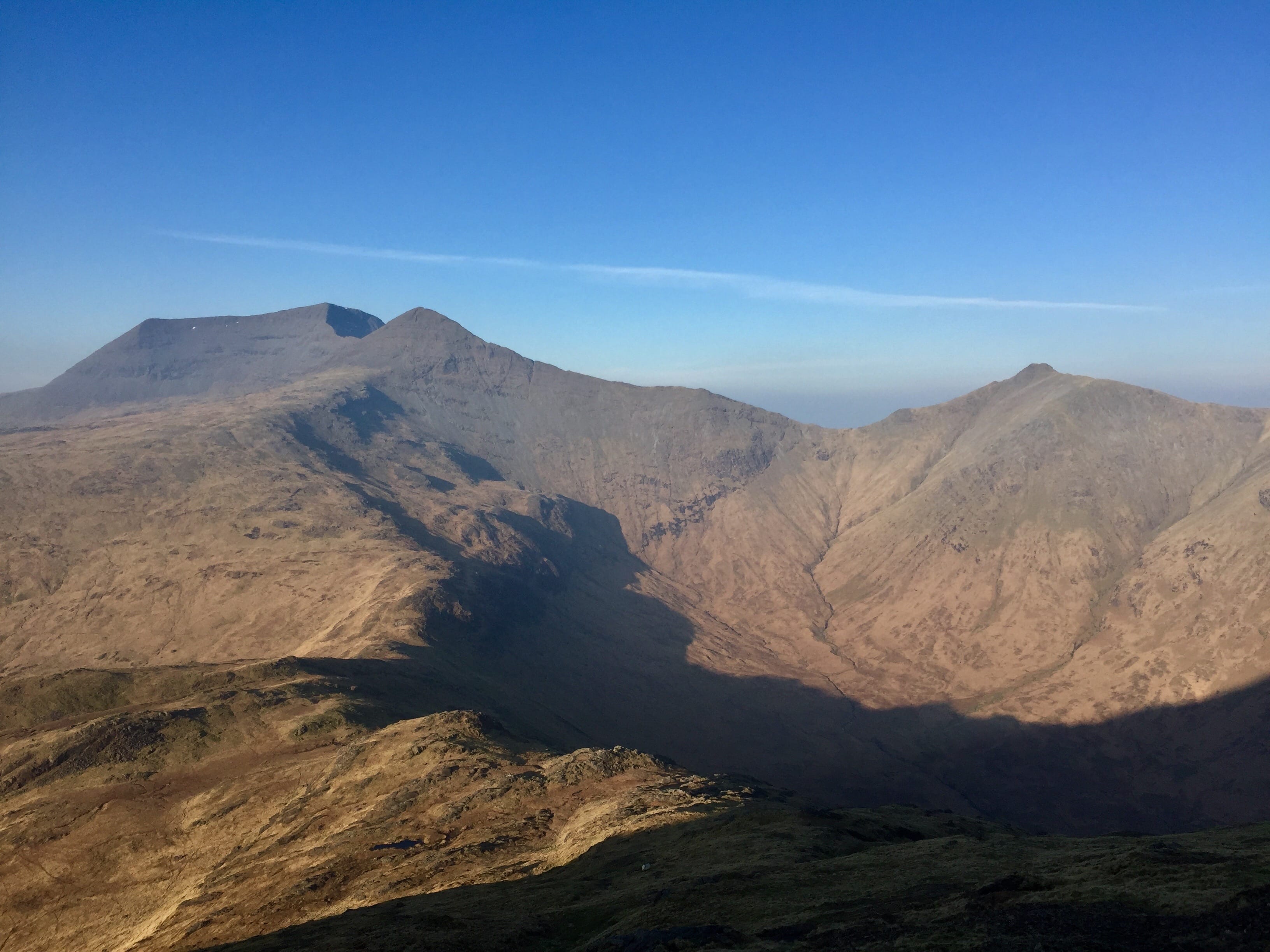 HEIGHTS OF WINTER: Snow-free and sun-kissed Ben More, A'Chioch and Beinn Fhada from ascent of Cruachan Dearg