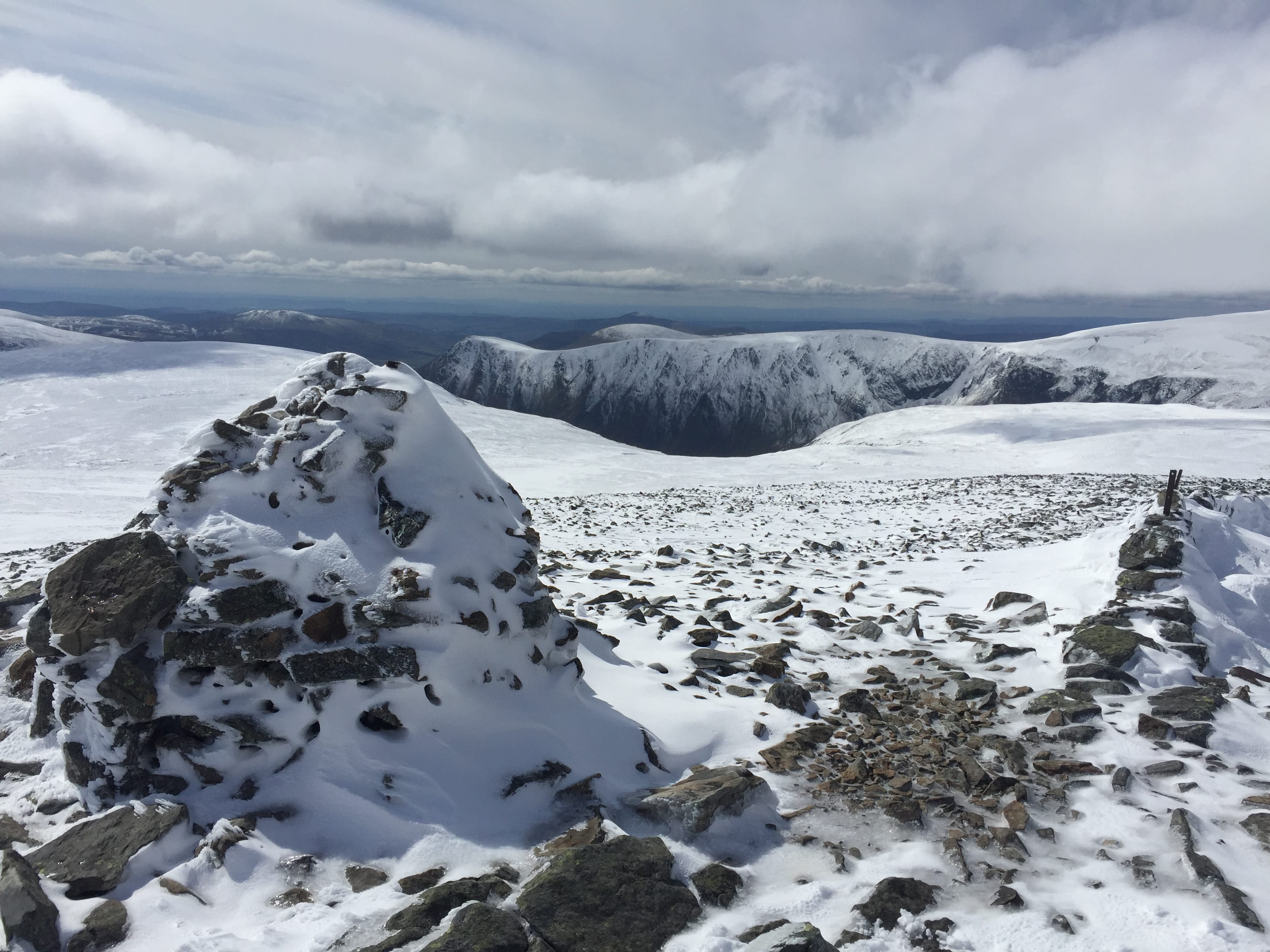 DEEP IMPACT: The summit pile of Cairn of Claise, a hill transformed by snow, looking over to Glas Maol