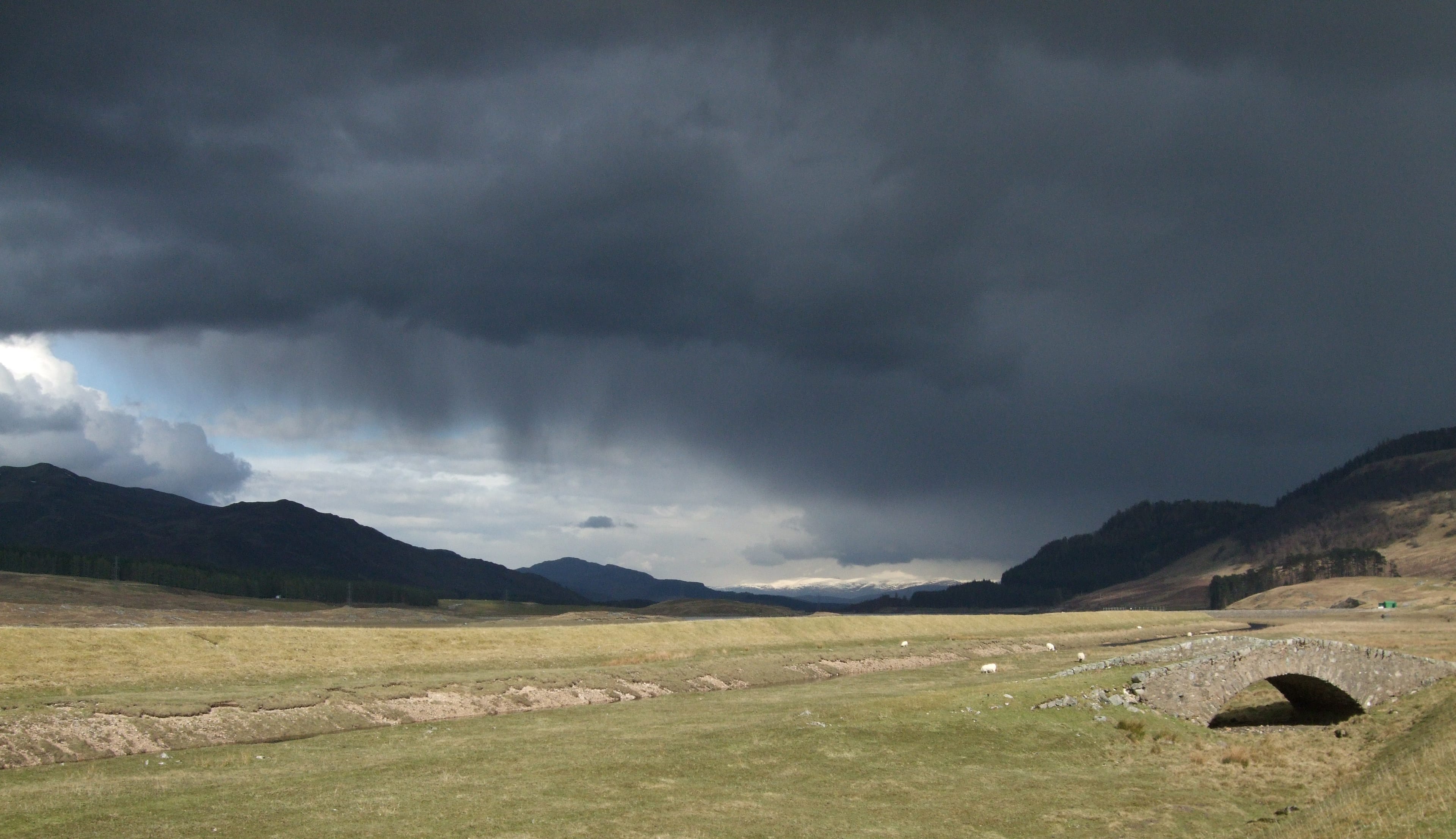 DARK SKIES: Stormy weather charging towards us as we made our way back along the road from Geal Charn