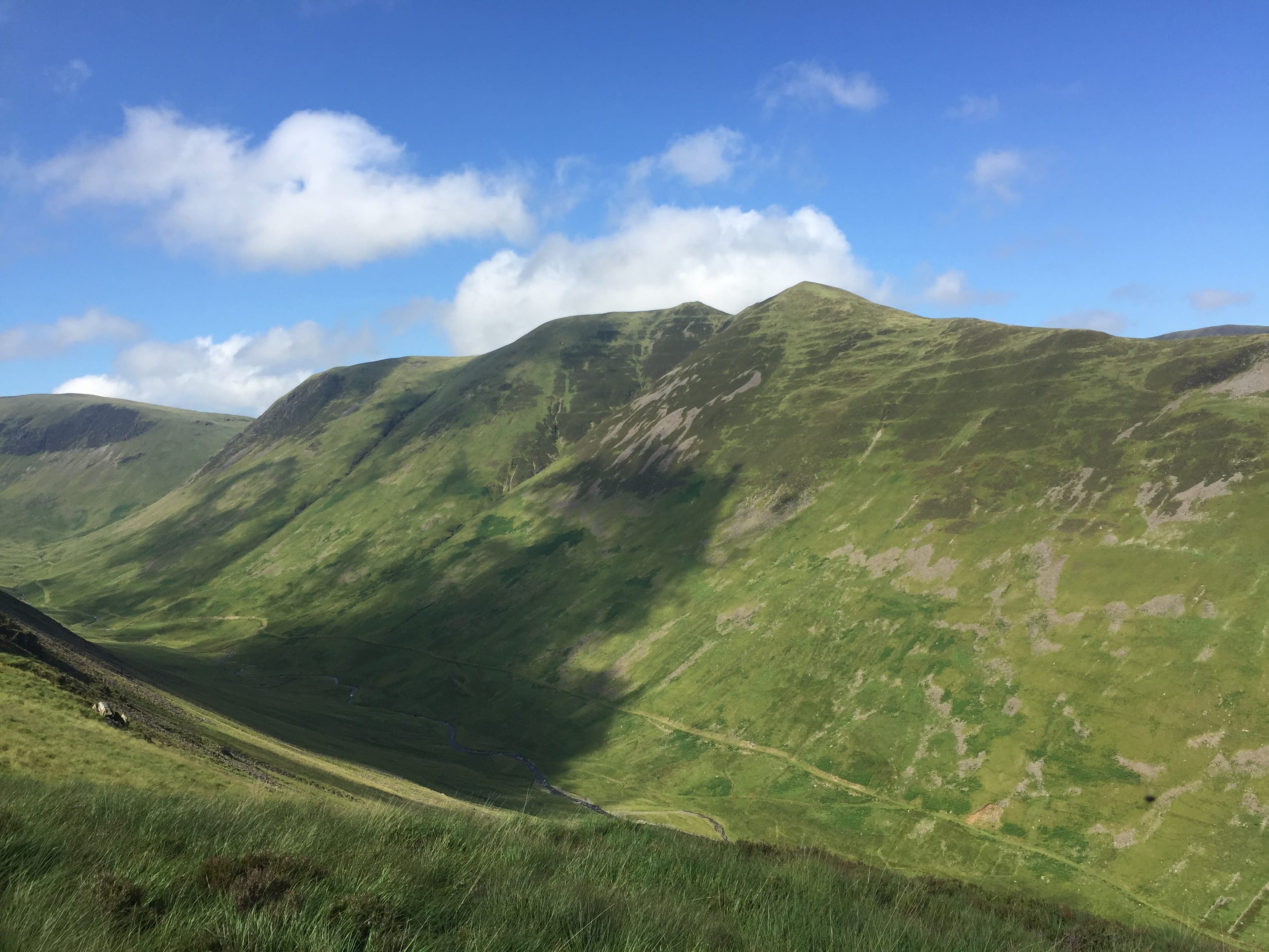 THE WAY IT SHOULD HAVE BEEN: Blue skies over the Saddle Yoke summits during the descent from as grey day