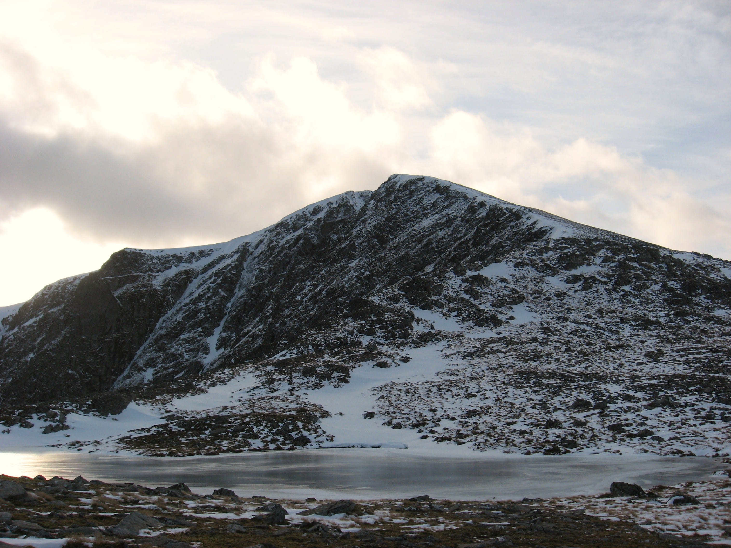 ICE PALACE: The final slopes of Seana Bhraigh soar above frozen waters from the northern approach 