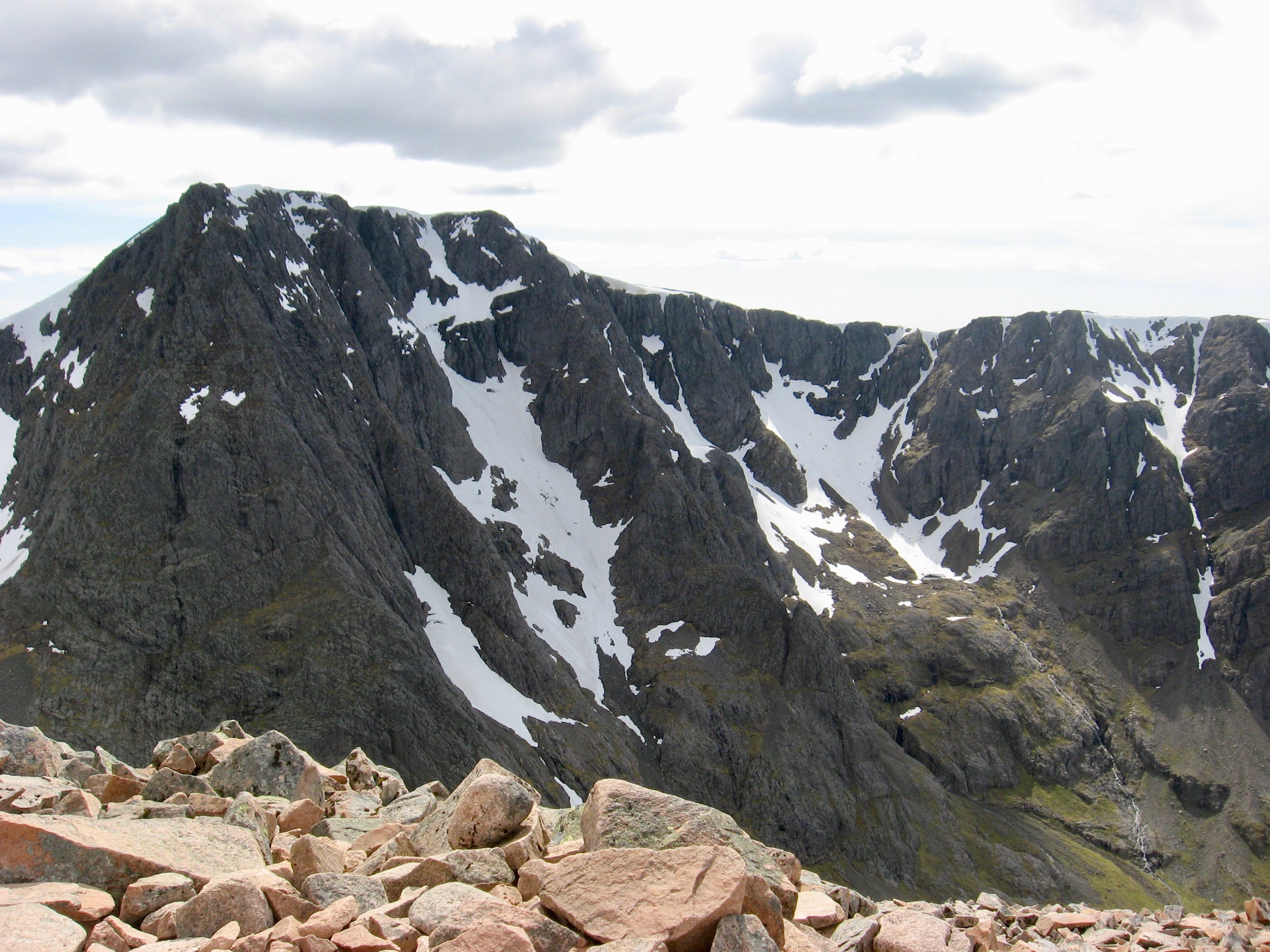 TOWERING PRESENCE: The North Face of Ben Nevis, still holding patches of snow in late summer, from summit of Carn Mor Dearg