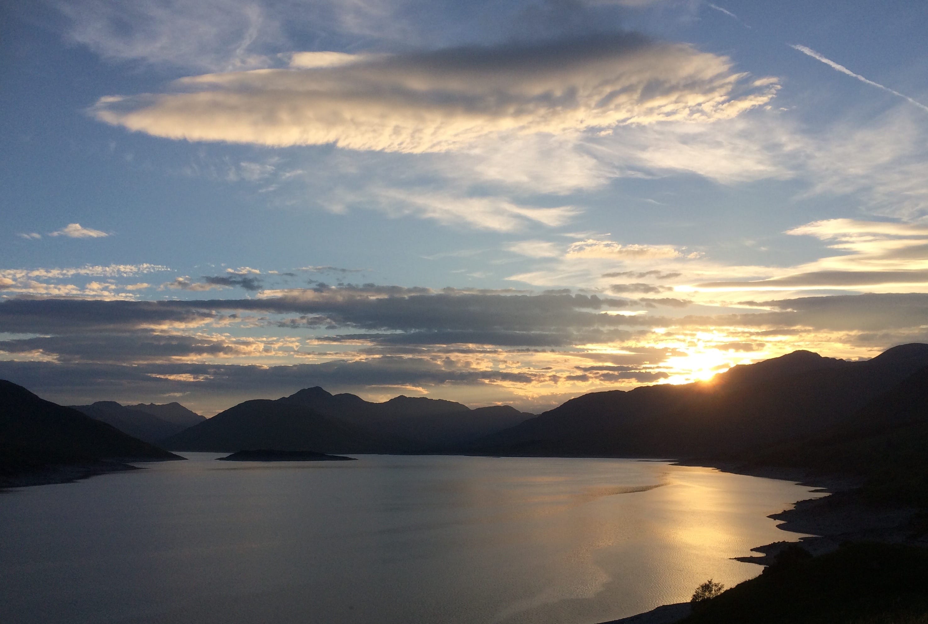 'Q FOR A CHANGE: Mountain silhouettes under the setting sun around Loch Cuaich – or Loch Quoich if you prefer'