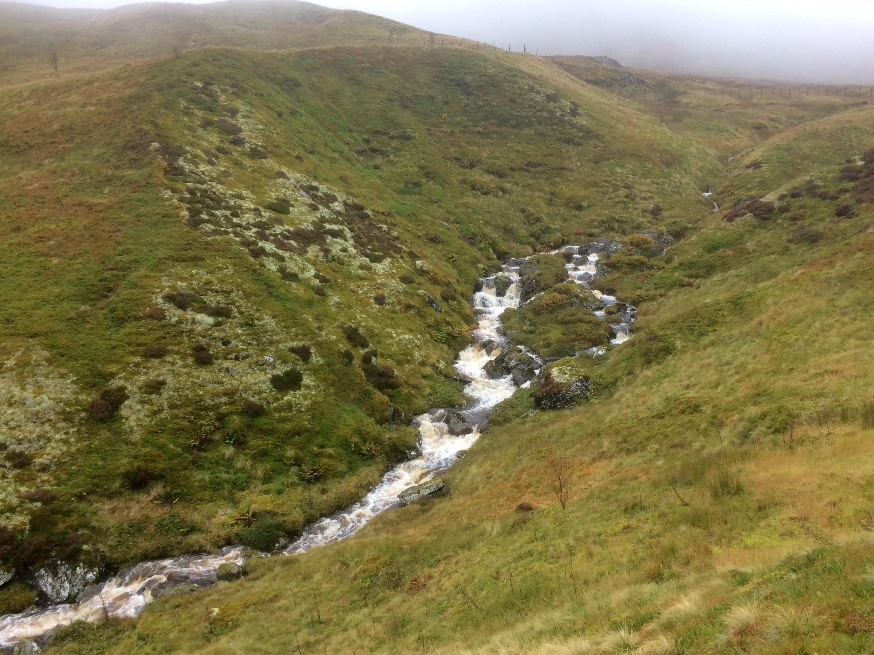 'WET AND WILD: White water rushes down Coire Odhair during torrential rain on a day''s walk in the Ben Lawers range'