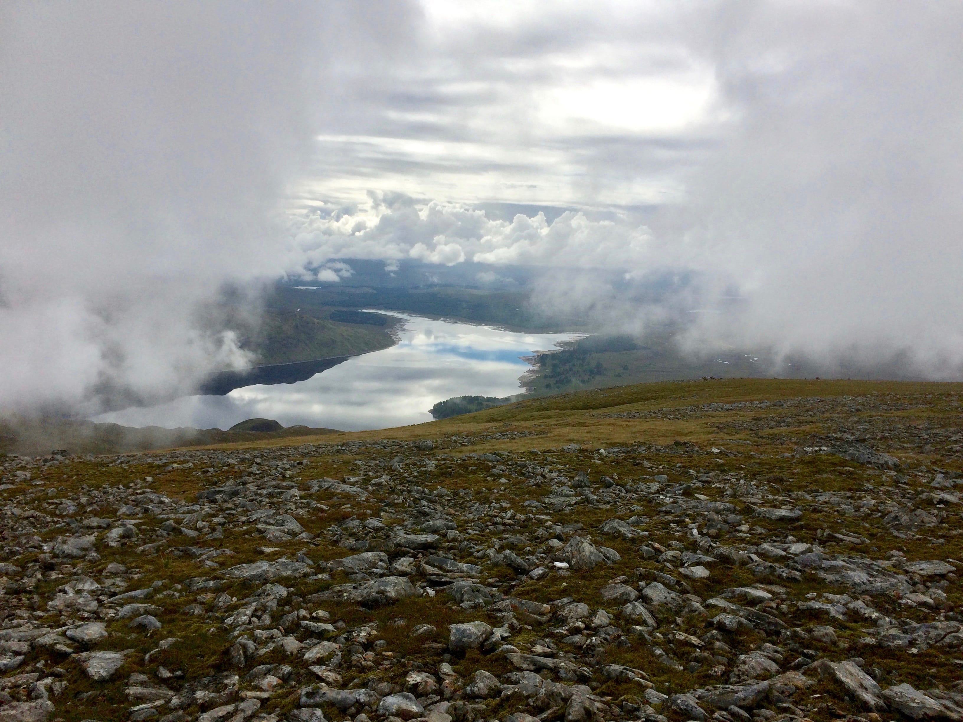PARTING OF THE WAYS: The cloud curtains draw back on Ben Alder to reveal the blue of Loch Ericht far below