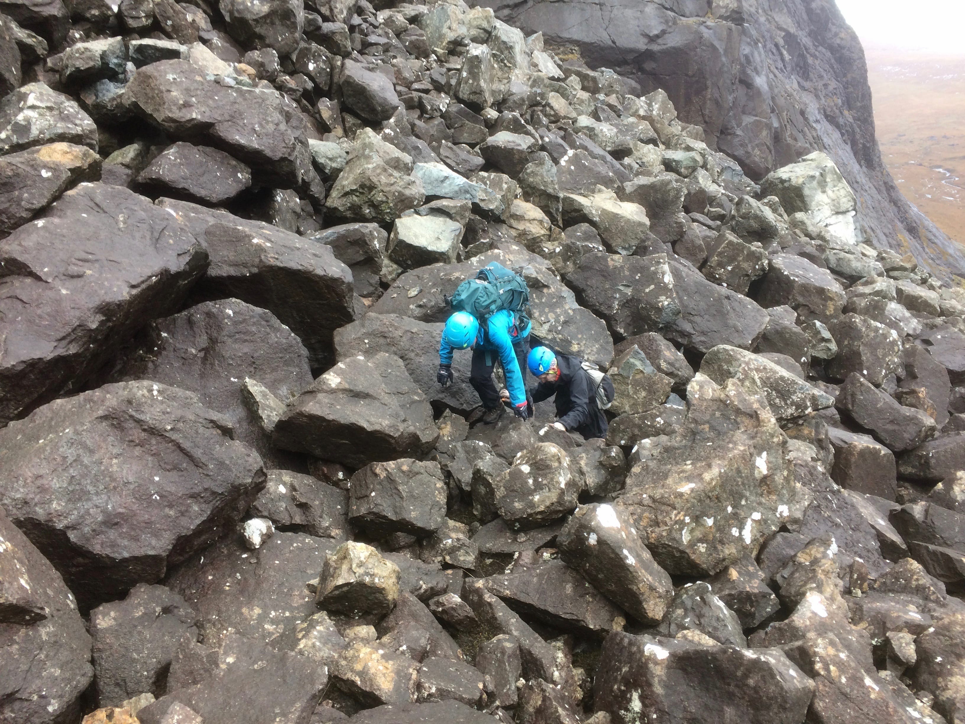TO BOULDERY GO ... Scrambling across the giant boulder debris on the ascent of Sgurr Sgumain in damp conditions