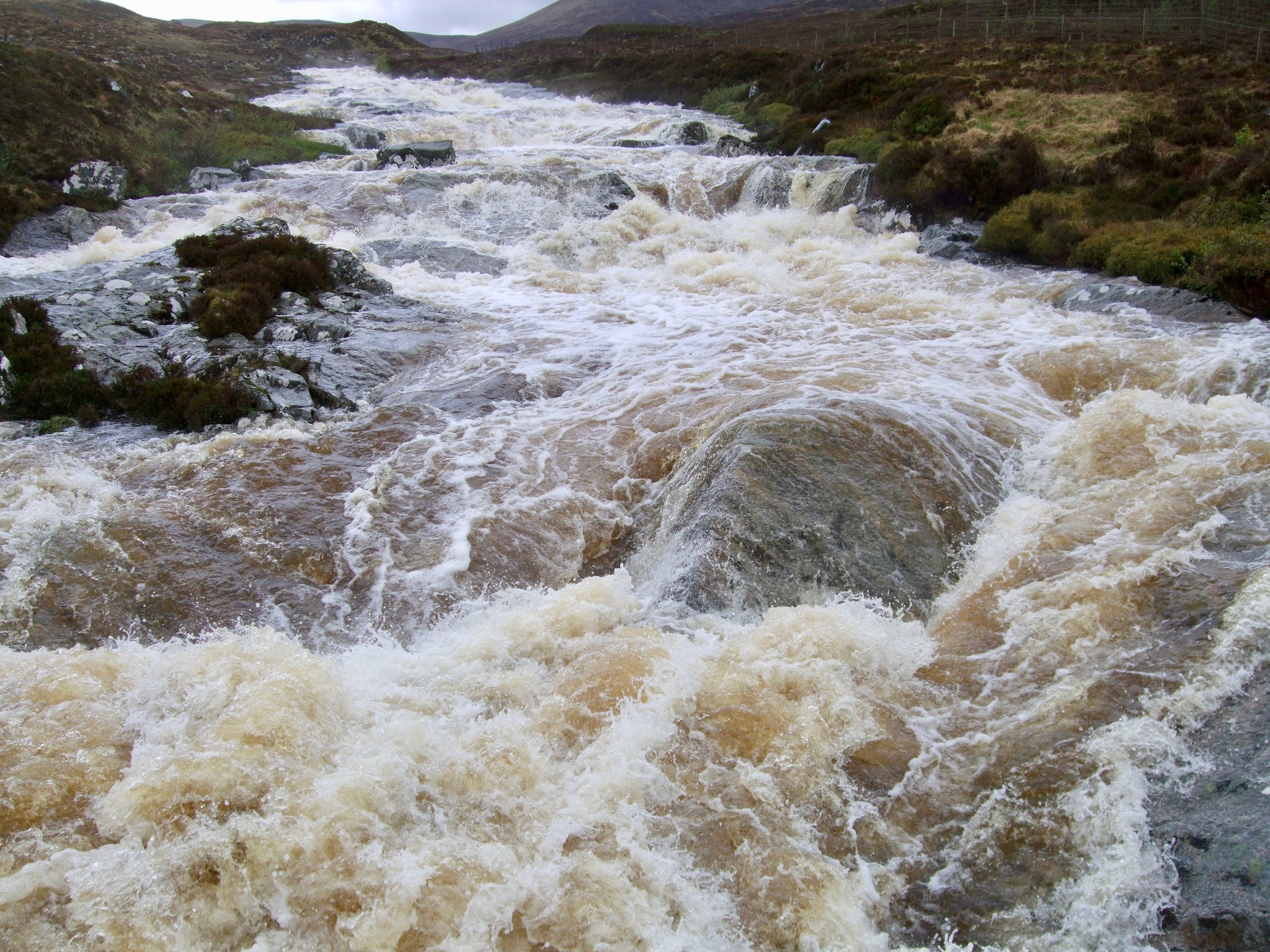 'WHITE WATER BARRIER:  The raging Uisge Labhair in the Alders range which we faced during attempt on Aonach Beag'