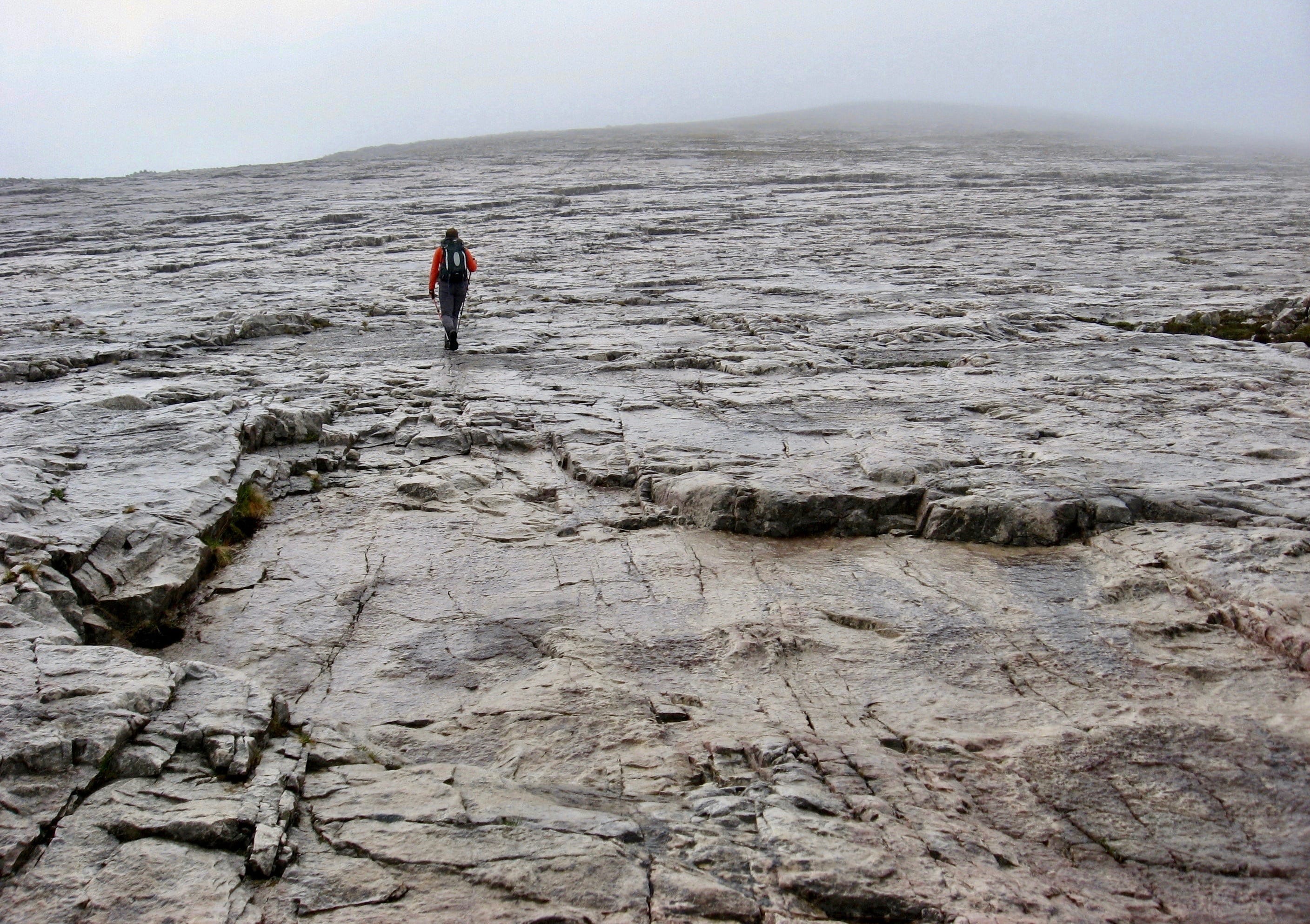 'MOONSCAPE ASCENT: Heading up the wide swathe of quartzite slabs to the summit of Sgurr Ban on a grey, misty day'