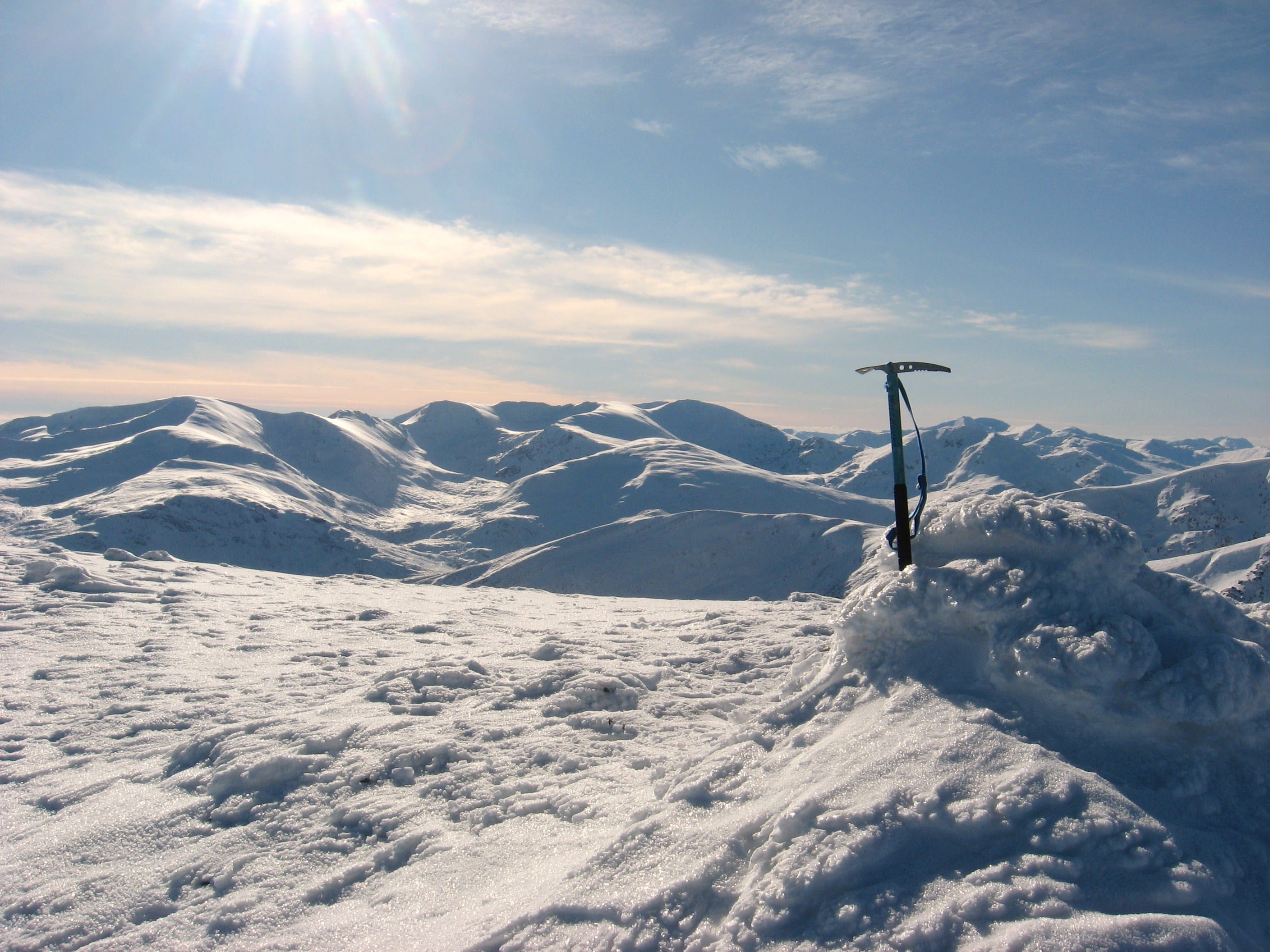 THE WAY IT WAS: A white blanket of hills under a blue sky and sun from Carn nan Gobhar in the Mullardochs on a perfect winter day