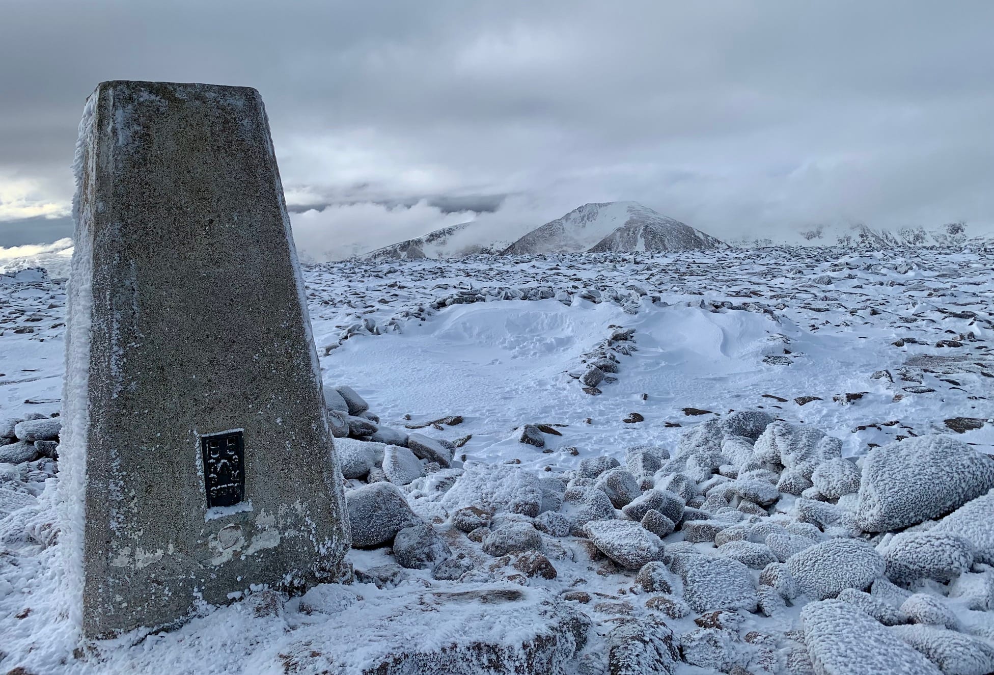FROZEN KINGDOM: Pure white landscape from the summit of Ben Macdui with Cairn Toul and its neighbours in wreaths of wispy cloud