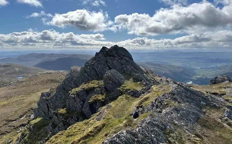 SADDLE SOAR: Looking along to the main summit rock tower of Sgorr na Diollaid in the depths of Mullardoch