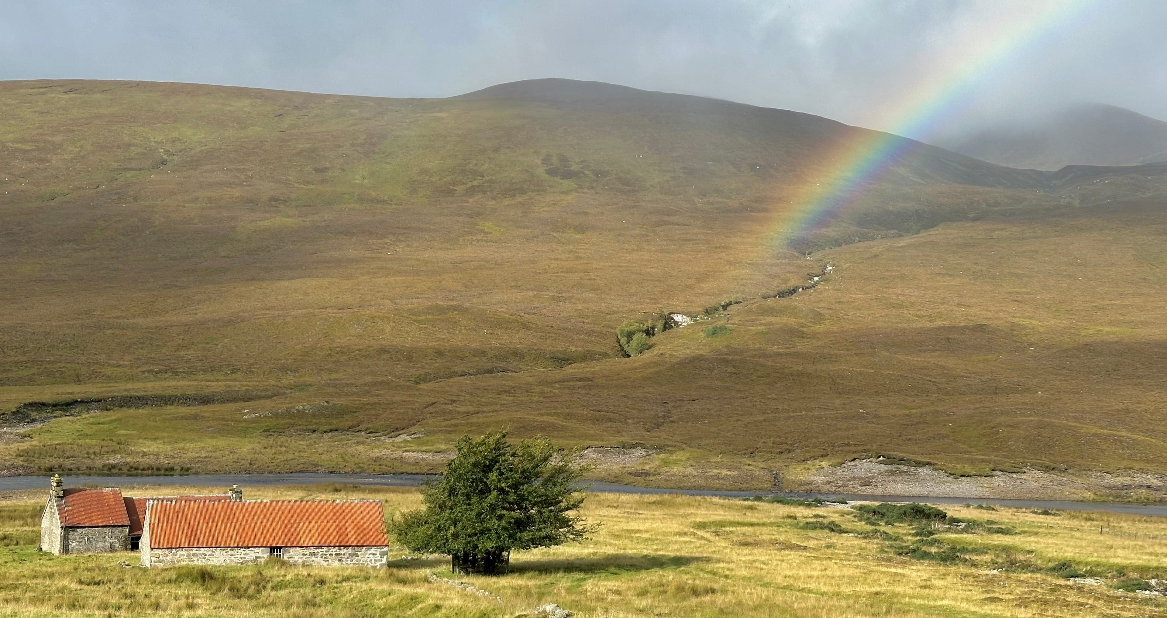 RAINBOW MOMENT: Colourful interlude over the old houses at Lubachlaggan on way to Beinn a' Chaisteil